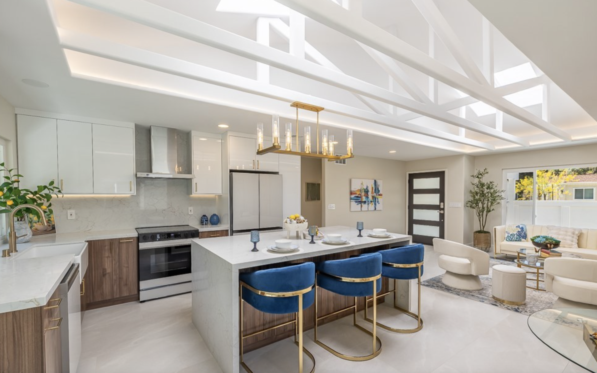 Whole-home renovation with custom fireplace wall and open kitchen